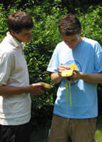 Photo of volunteers mapping invasive plants. 