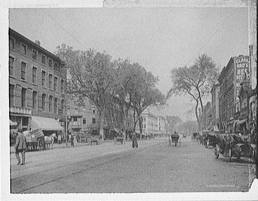 Black and white image of the buildings and people on Elm St. in Manchester, New Hampshire c1920.