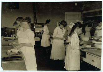 Teenage girls in cooking class.
