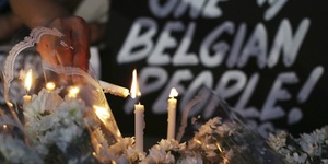 Brussels mourns, Belgium on alert as police hunt suspect