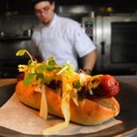 A Limonsine beef hotdog from Peterson Farms is plated before heading to a customer at the bar at Heirloom, a new St. Paul neighborhood restaurant. All meat at Heirloom is organic and free range. // Review: goo.gl/9Vr0U4 // Photo by Ginger Pinson of the @pipress
