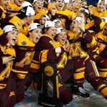 Minnesota players celebrate with the trophy after defeating Boston College 3-1 in the women's Frozen Four championship college hockey game in Durham, N.H. Sunday, March 20, 2016. Photo by Winslow Townson of the Associated Press