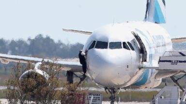 PHOTO: A person is seen here jumping out of the cockpit of EgyptAir Flight 181 at Larnaca airport in Cyprus, March 29, 2016.