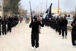 ISIS extremists parade down a street in Raqqa, Syria, on Jan. 14, 2014. (ISIS Website via AP)