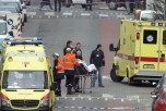 Emergency services evacuate a victim by stretcher after a explosion in a main metro station in Brussels on Tuesday, March 22, 2016. (AP Photo/Virginia Mayo)