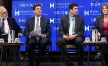 (L to R) David Wessel, director of the Hutchins Center on Fiscal and Monetary Policy at Brookings; Phillip Swagel, professor, Maryland School of Public Policy; Ben Spielberg, research associate, Center on Budget and Policy Priorities; and Wendy Edelberg, economist at the Congressional Budget Office speak, March 21 at Brookings Institution, on preparing for the next recession. (Gary Feuerberg/ Epoch Times)