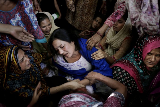 Women try to comfort a mother who lost her son in bomb attack in Lahore, Pakistan, on March 28, 2016. The suicide bombing targeted Christians who gathered for Easter celebrations. (AP Photo/K.M. Chaudary)