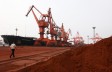Bulldozer scoop soil containing various rare earth to be loaded on to a ship at a port in Lianyungang, east China's Jiangsu Province on Sept. 5, 2010, for export to Japan. (STR/AFP/Getty Images)