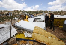 Palestinians look at the remains of a school project that was funded by the European Commission Humanitarian Aid and Civil Protection (ECHO) and was demolished by Israeli forces, in Khirbet Tana near the West Bank city of Nablus March 29, 2016. REUTERS/Abed Omar Qusini           