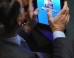 Berlusconi MP caught ogling at escort website on iPad during debate