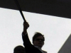 Charlie Sheen waves machete on rooftop
