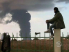 Qaddafi, rebels fight in Libyan oil fields