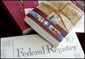 Stack of regulatory publications, including the Federal Register.