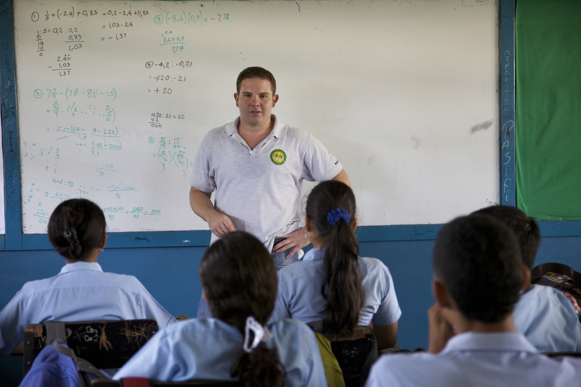 Image of a man from the Peace Corps teaching a class