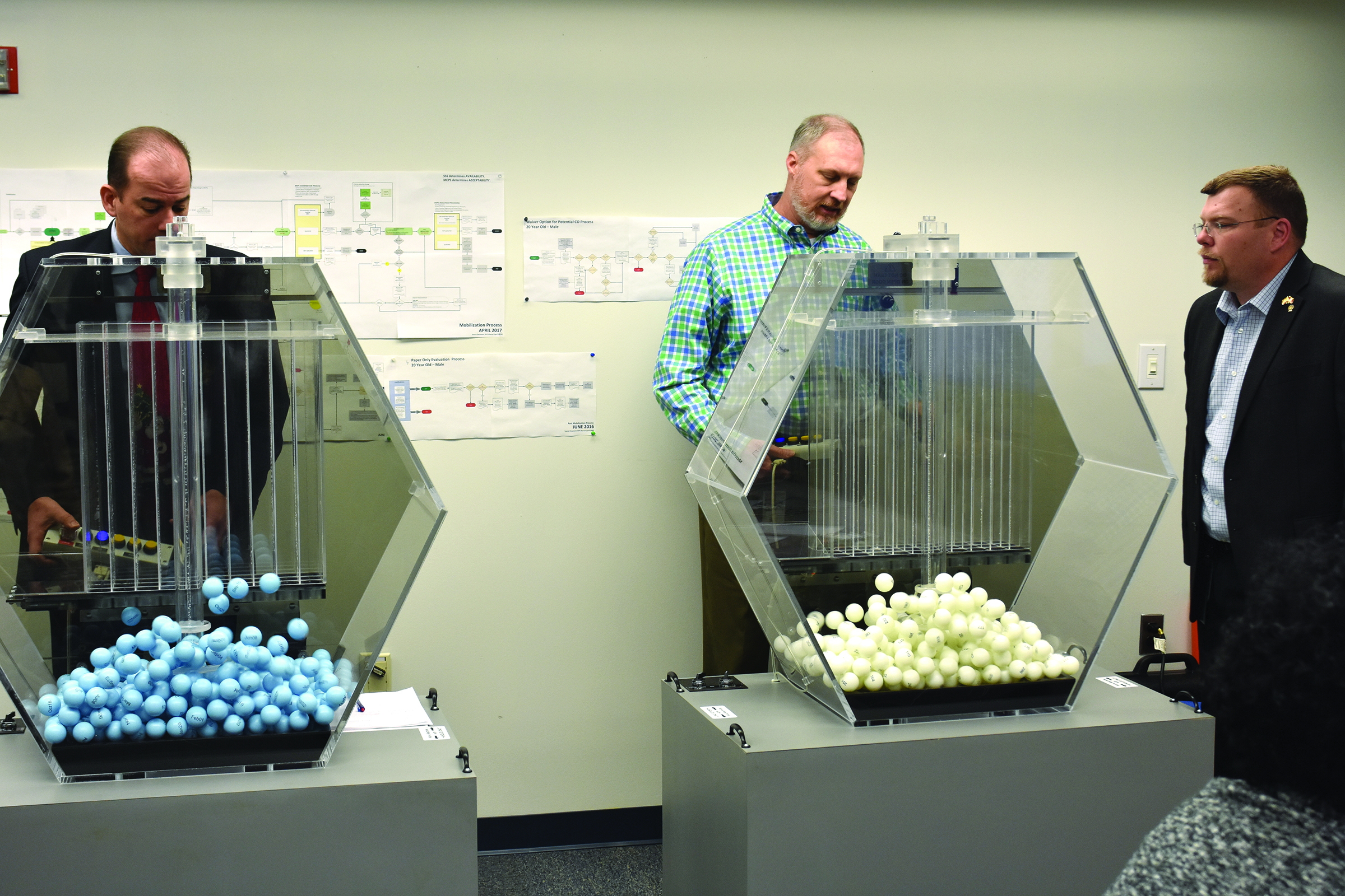 Source: Selective Service System, Selective Service System employees test draft-lottery equipment.