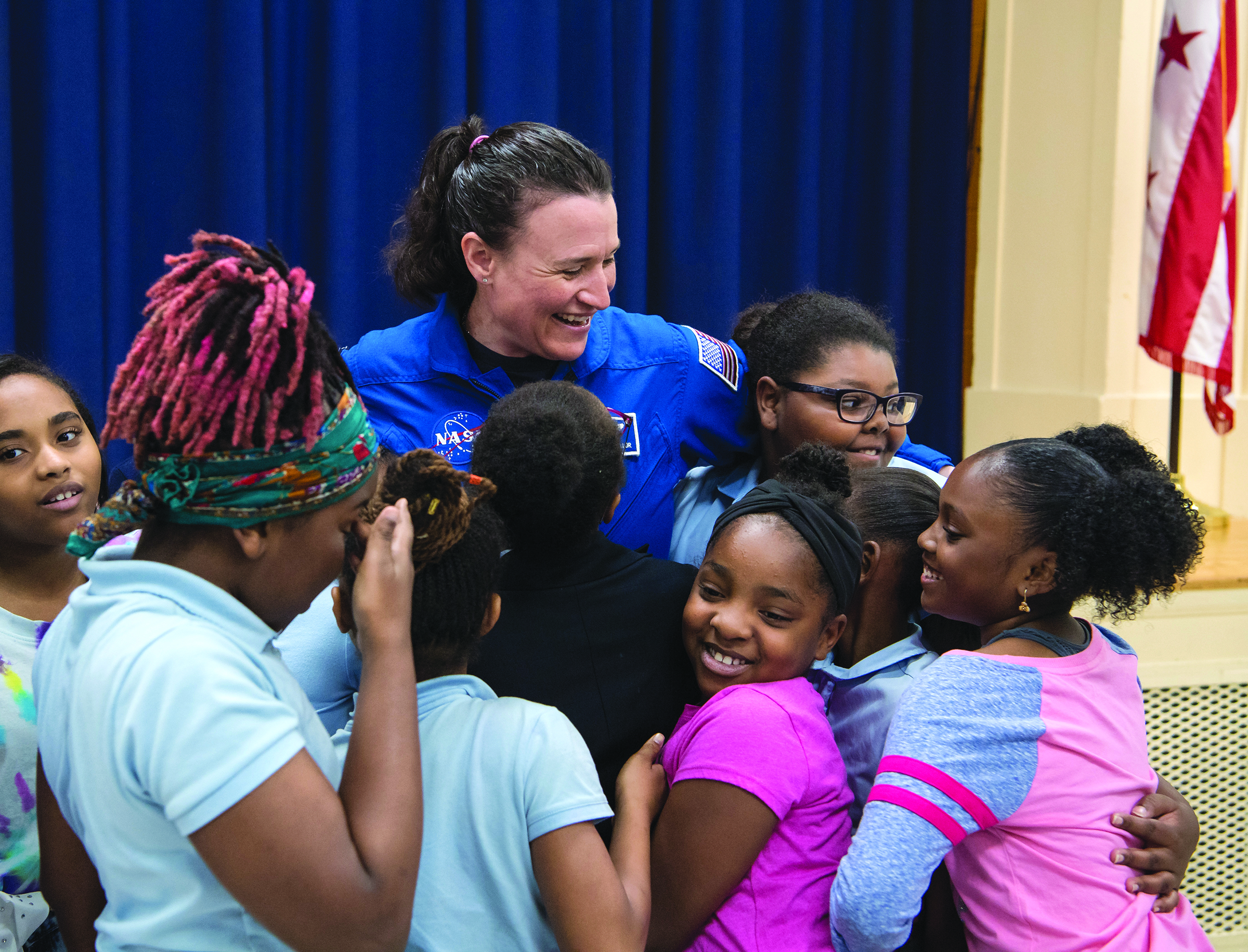 Source: NASA, Students greet a NASA astronaut after a presentation about her International Space Station experience.