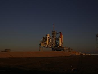 Space shuttle Discovery stands on the launch pad.