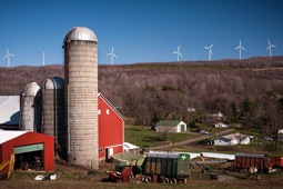 Wind turbines overlook farm