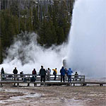 A crowd gathers to watch as Giant Geyser erupts.