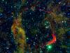 Infrared images from NASA's Spitzer Space Telescope and Wide-field Infrared Survey Explorer (WISE) are combined in this image of RCW 86