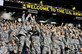 Army soldiers jump to catch mini-footballs during the Army All-American Bowl at the Alamodome in San Antonio, Jan. 7, 2012. The soldiers are assigned to advanced individual training units. U.S. Army photo by Staff Sgt. Teddy Wade