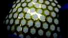 Optical image of flexible and stretchable thin film transistor array covering a baseball shows the mechanical robustness of this backplane material for future plastic electronic devices.