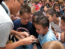 Students observe experiment.