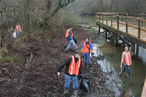 Earth Team volunteers clean up a creek along the Reservoir as part of the Great American Cleanup in March 2011.