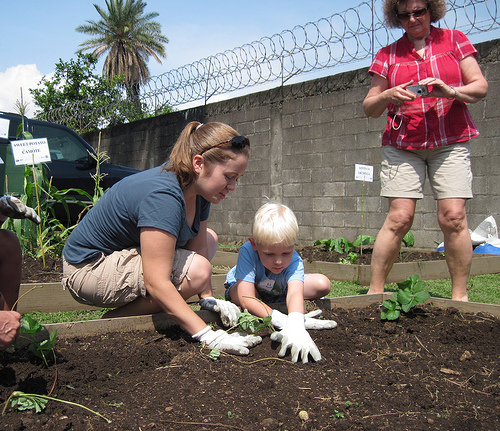 Sara Roy and her son, Malachi, enjoy working together in the garden.