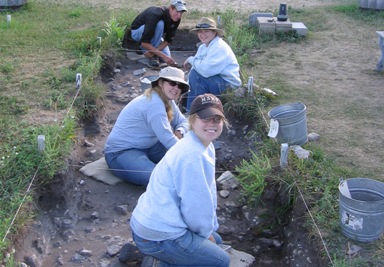 Archaeology crew members in action at Colonial Michilimackinac