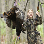 2012 Spring Turkey Hunting Digest cover photo - Girl with harvested turkey.