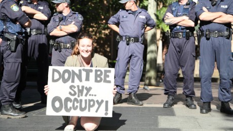 Female 'Occupy Melbourne' protester in front of police