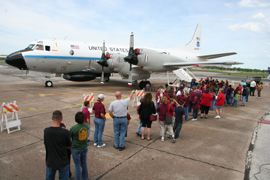 Visitors line up to board the NOAA P3 Hurricane Hunter plane during a stop in Beaumont, Tex., last year.