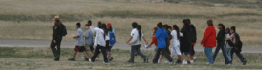 Ranger leading a group of students on a field trip