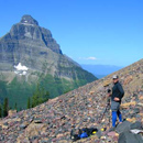 Dan Fagre sets up a repeat photo in Glacier National Park.