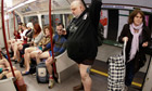 Participants in a global no trousers day flashmob ride the London underground on Sunday
