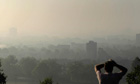 Duncan blog : The ultimate climate change FAQ : A man looks out at smog covering central London