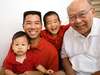 Photo: Multi-generational Asian family smiling indoors