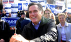 Mitt Romney greets voters outside a polling station in New Hampshire