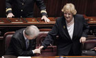 Italy's prime minister, Mario Monti, shakes hand with the interior minister, Anna Maria Cancellieri