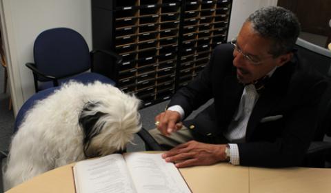 Dr. Cortez Assists Reading Therapy Dog Boudreaux