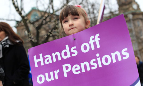 A girl holds a protest placard during a public sector strike over pensions last year