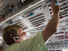 A technician works inside shuttle Atlantis following its landing on the STS-132 mission