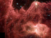 An infrared view from the Spitzer Space Telescope of the eastern edge of giant stellar nursery W5, about 7,000 light-years away in the constellation Cassiopeia