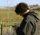 Person monitoring weeds with GPS