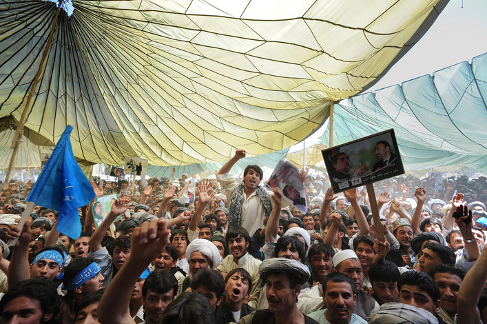 Several thousand people gather for a rally to support Afghan presidential candidate Abdullah Abdullah in Maymana, Afghanistan. Abdullah stated his belief that trust between the government and people needs to be restored.