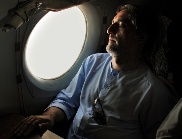 Afghan presidential candidate Abdullah Abdullah naps on his way back to Kabul following a rally in Maymana, Afghanistan.