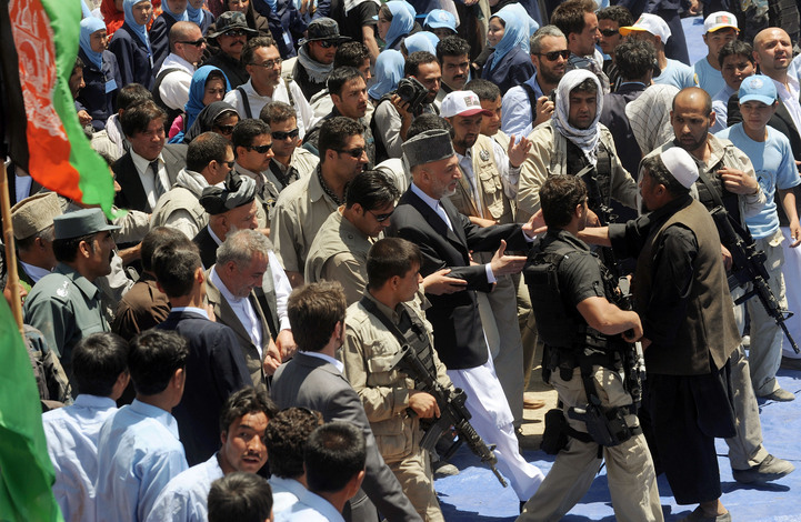 Afghan President Hamid Karzai arrives under heavy guard at a rally in Baghlan Province, Afghanistan. Karzai became Afghanistan's first popularly-elected president in 2004. 