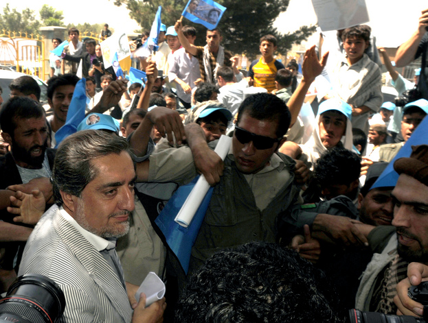 Afghan presidential candidate Abdullah Abdullah is surrounded by a crush of supporters, media and security personnel as he arrives for a rally at the National Stadium in Kabul. Abdullah is largely considered to pose the biggest threat to President Hamid Karzai.