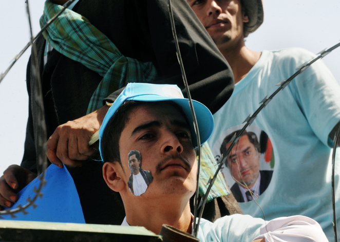 Supporters wait for the arrival  of Afghan presidential candidate Abdullah Abdullah at the National Stadium in Kabul.